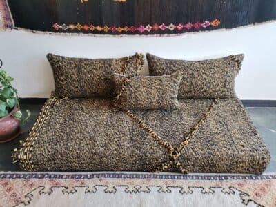 Main image of Moroccan floor sofa in black and mustard mix – handcrafted low seating with minimalist cushions for stylish and bold spaces