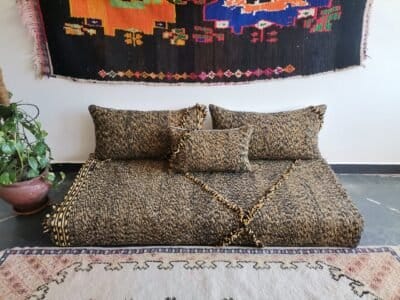 Main image of Moroccan floor sofa in black and mustard mix – handcrafted low seating with minimalist cushions for stylish and bold spaces