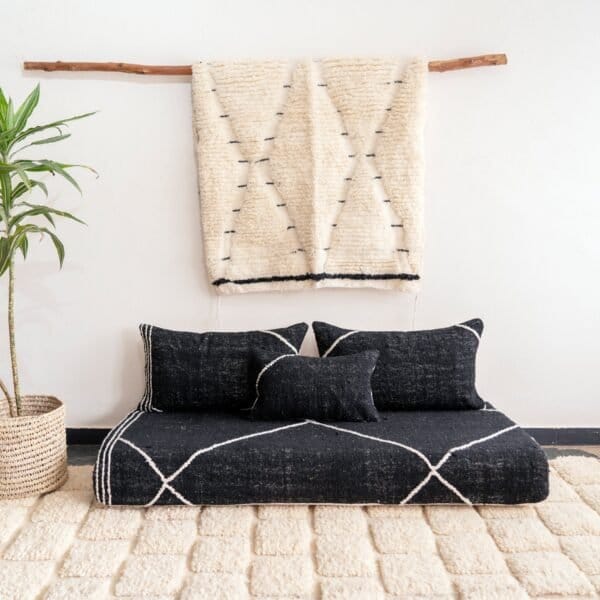 Top view of Moroccan black floor sofa – handwoven cover set with cushions for bohemian, industrial, or contemporary decor