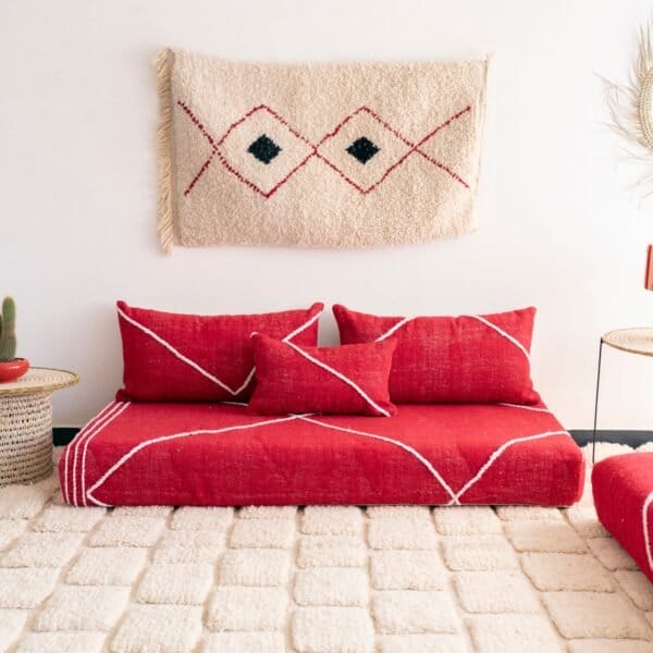 Handcrafted red Moroccan floor seating – bold and stylish sofa with plain cushions for bohemian and modern living rooms