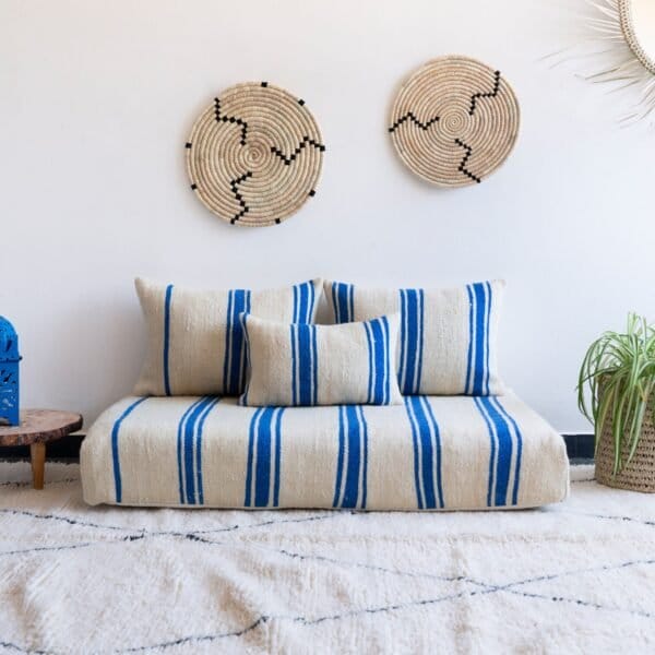 Main image of Moroccan wool floor couch in cream with blue stripes – artisan low seating for modern, airy boho homes