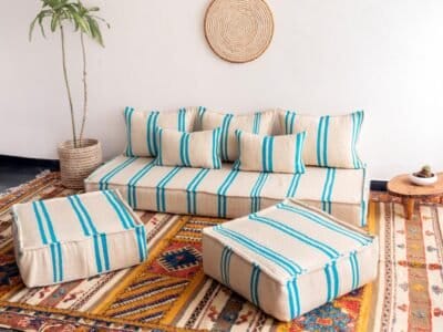 Top-down image of Moroccan cream sofa with turquoise lines – artisan low floor seating for coastal-inspired homes