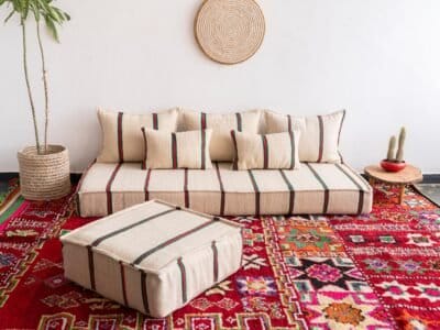 Main image of Moroccan wool floor couch in cream with red and green stripes – low handcrafted seating with cushions for festive boho vibes