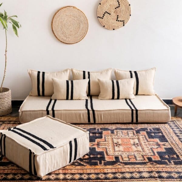 Main image of Moroccan handmade wool floor sofa in cream with bold black stripes – low artisan seating for modern rustic homes