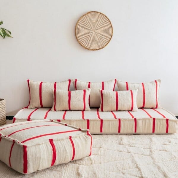 Main image of Moroccan handmade wool floor sofa in cream with thin red lines – elegant low seating for boho homes in the UK, US, and Australia