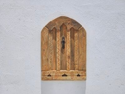 Berber carvings on reclaimed cedar wood panel with vintage finish