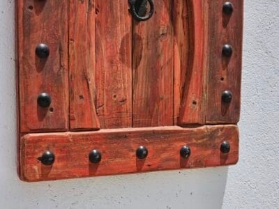 red wood and iron nails on bottom part of Moroccan decorative panel