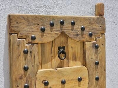 handcrafted Moroccan shutter highlighting rivet design