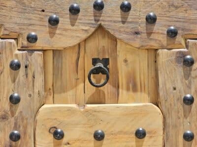 top panel and door knocker of Moroccan cedar shutter