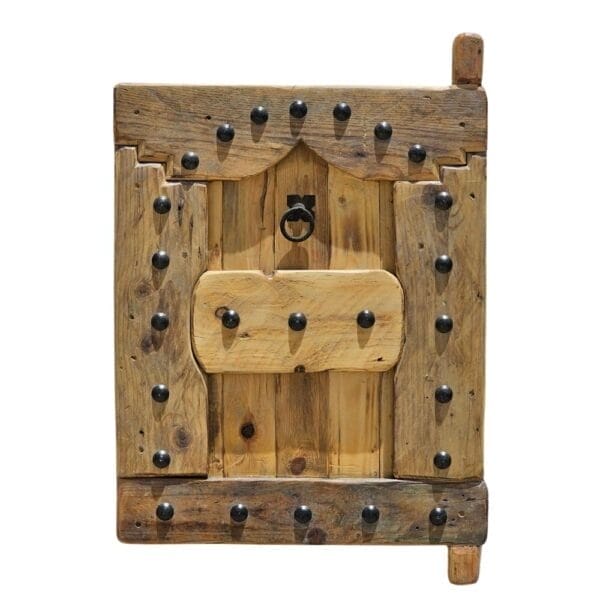 vintage wooden Moroccan shutter with black iron studs