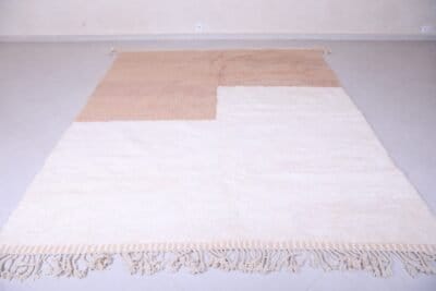 custom Beni Ourain Moroccan rug in warm ivory and tan, blending modern design with authentic Berber craftsmanship.