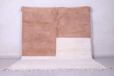 Contemporary handmade Moroccan Beni Ourain rug in ivory and tan, crafted with 100% natural lamb wool and traditional Berber weaving.