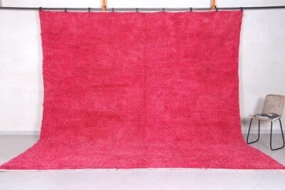 Handmade Moroccan rose pink wool rug with soft Beni Ourain texture.