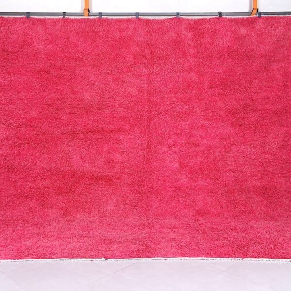 Handmade Moroccan rose pink wool rug with soft Beni Ourain texture.