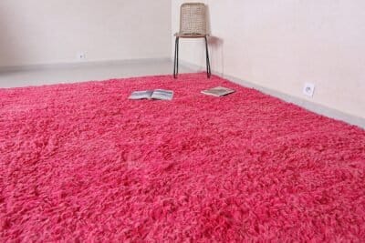 Moroccan Beni Ourain rose pink rug with plush surface.