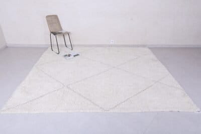 Moroccan wool rug featuring tan geometric trellis design, showing thick plush wool texture and expert hand-knotting.