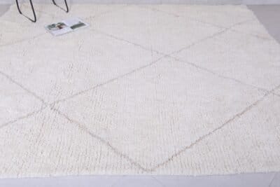 custom-sized white and tan Moroccan rug, emphasizing soft wool pile and elegant geometric design.