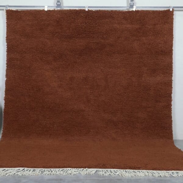 Handmade Moroccan dark brown wool rug with traditional Beni Ourain design and rich texture.