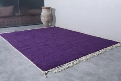handmade Moroccan royal purple wool rug with plush texture.