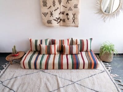 Artisan weaving colorful striped wool fabric for Moroccan cushions