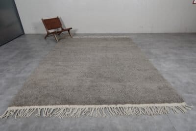 Left view of custom Moroccan taupe rug, handwoven from natural wool.