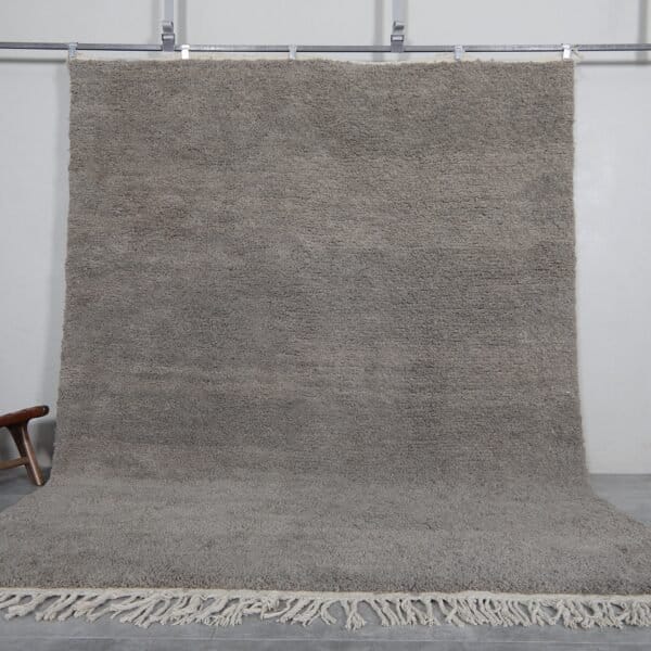 Handmade Moroccan taupe wool rug with Beni Ourain design and soft texture.