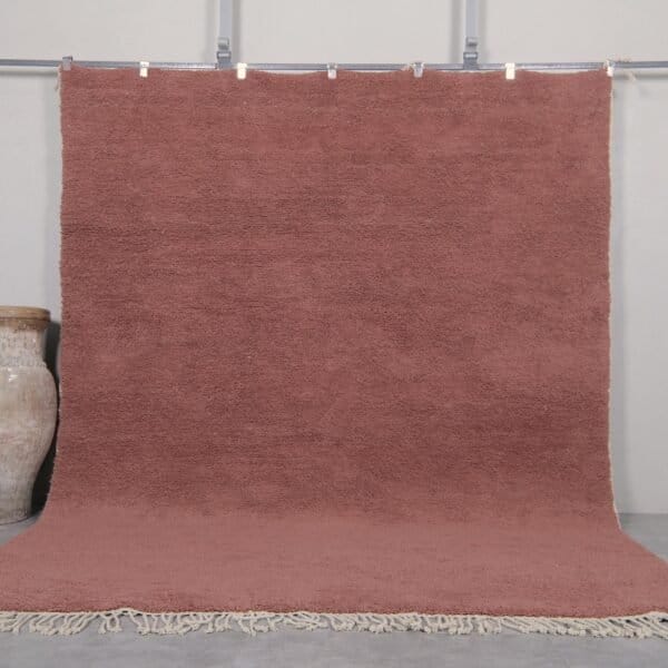 Handmade Moroccan rust brown Beni Ourain rug crafted with 100% natural lamb wool, featuring a rich, earthy solid color and a plush shag texture, perfect for adding warmth and elegance to modern or rustic interiors.