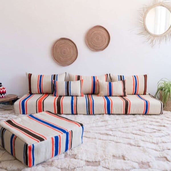 Handmade Moroccan floor couch set in cream wool with blue, orange, and black stripes, includes unstuffed cushions and pillows with zippered covers
