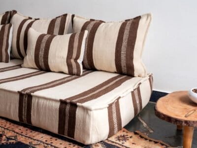 Bohemian room setup with Moroccan ivory and brown floor cushions
