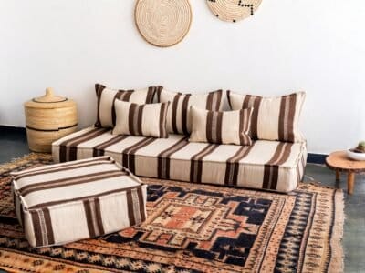Side view of Moroccan wool cushion cover in ivory with brown accents